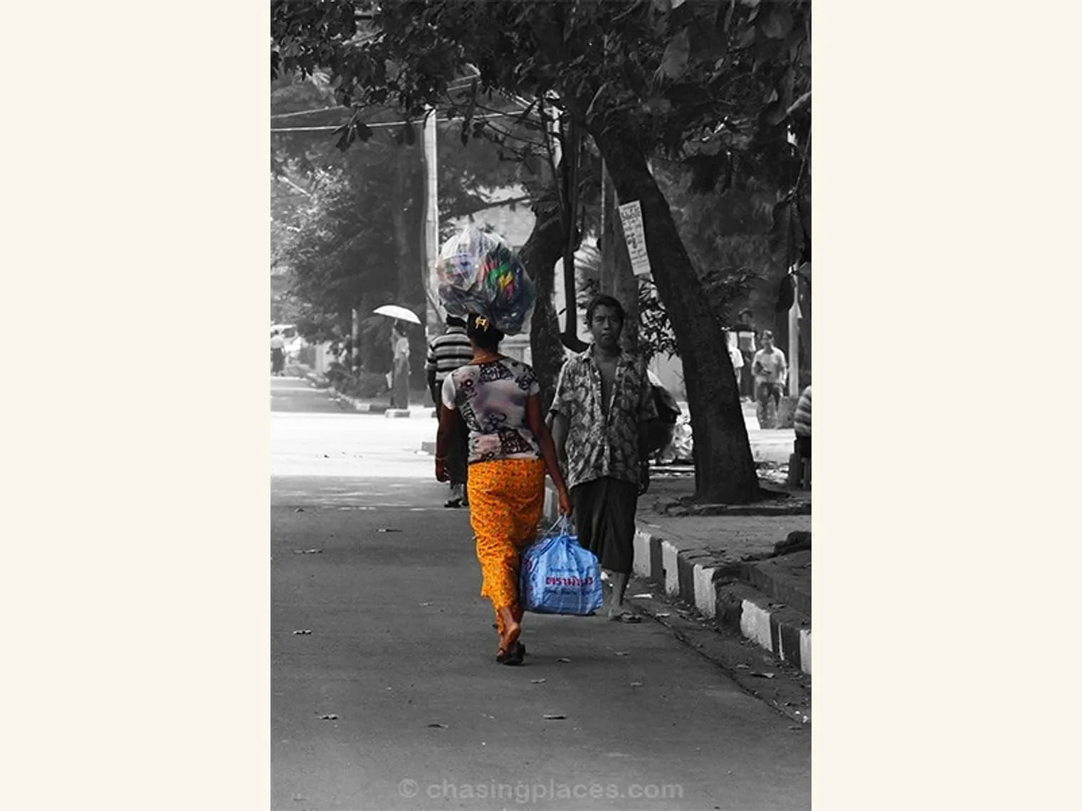 Ever wonder how sandals make their way to markets in Yangon? This middle aged woman was walking much quicker than me as she balanced this asymmetric load.